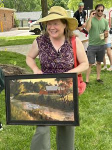 Artist holding painting